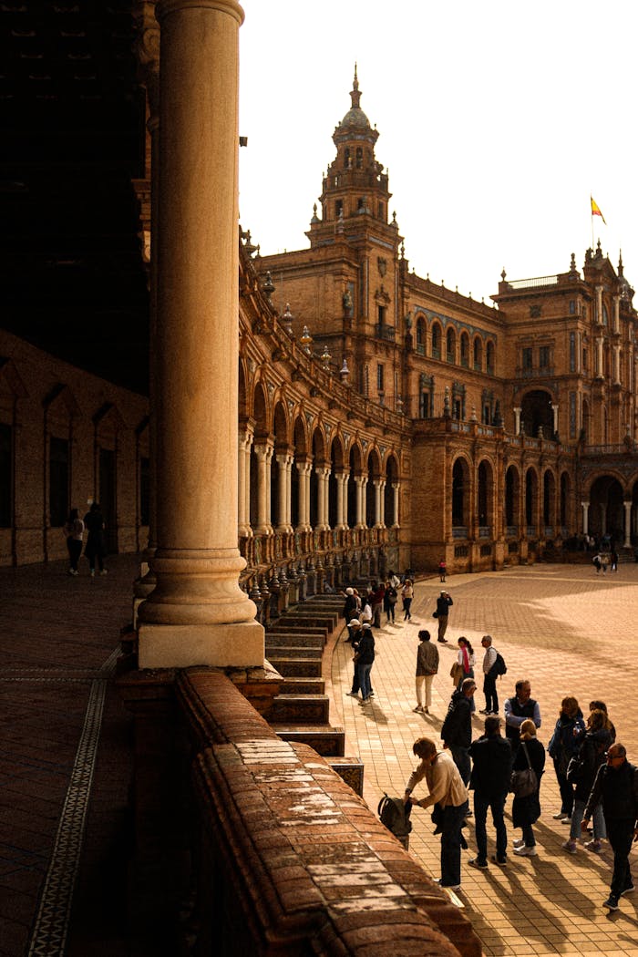 our-story Visitors at the historic Plaza de España in Seville, capturing its majestic architecture and lively atmosphere.